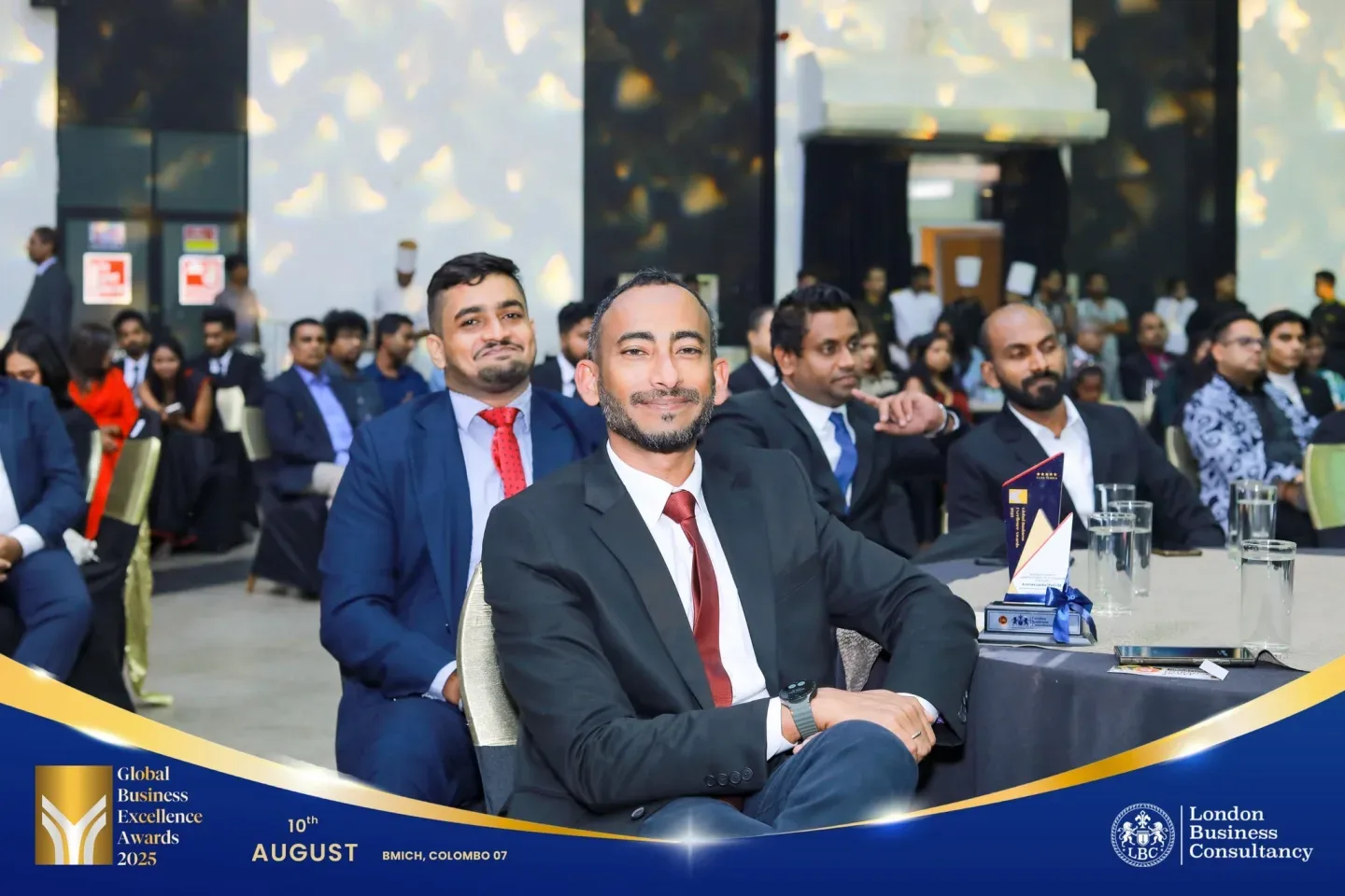 Global Business Excellence Awards recipient seated among ceremony guests