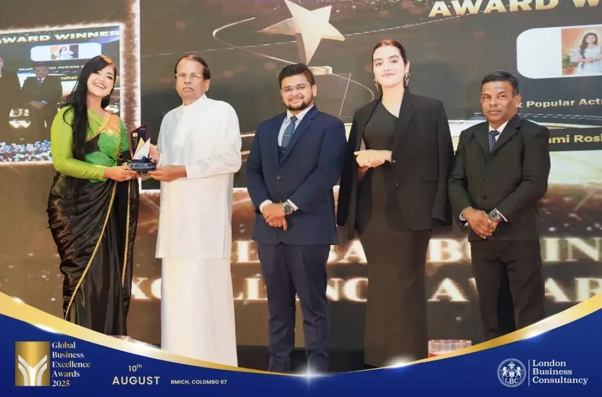 Global Business Excellence Awards recipient sharing a recognition moment on stage