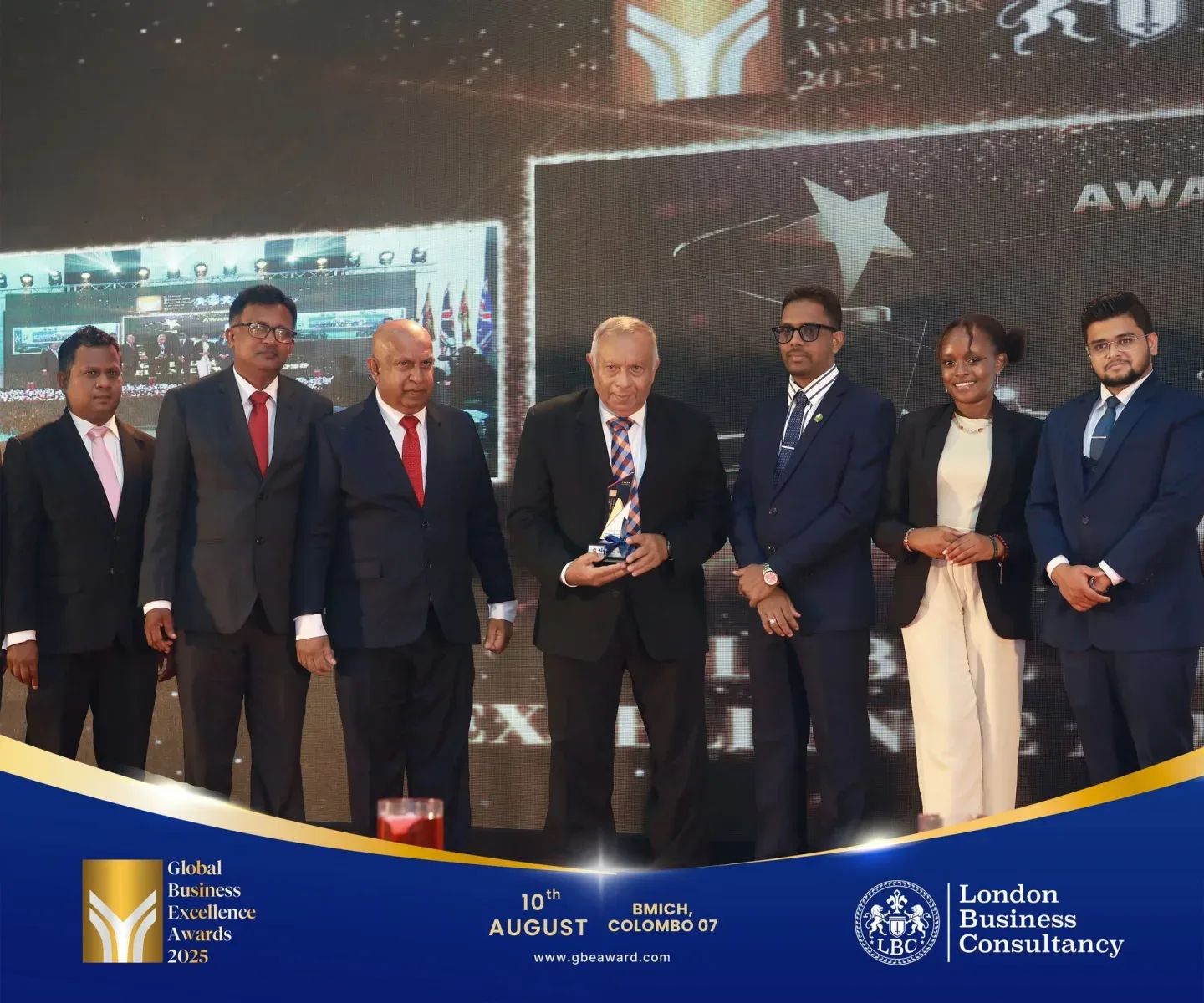 Global Business Excellence Awards recipient and programme representatives on stage